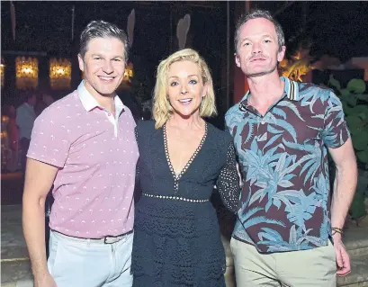  ?? SEAN ZANNI/PATRICK MCMULLAN GETTY IMAGES ?? David Burtka, Jane Krakowski and Neil Patrick Harris attend last weekend’s reopening of the Dorado Beach resort.