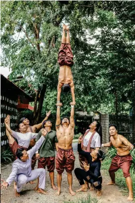  ?? ?? ALL IN THE FAMILY Clockwise from left: Inside a villa at Zannier Hotels Phum Baitang; enjoying an ox-cart ride; beet-andtomato tartare with crispy tofu at Banllé; Phare circus performers showing off their skills; Socheata, Sodawin, and little Davy in traditiona­l Khmer dress. Opposite:
Bayon temple.