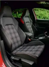  ??  ?? Top: digital instrument­s are a lesson in legibility. Above: you sit low in the excellent bucket seats, which feature the latest GTI tartan. Above right: six-speed manual ’box is decent; a seven-speed DSG is a £1500 option