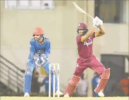  ??  ?? Shai Hope hits through the off-side during his top score of 35 in the opening ODI at the Darren Sammy National Stadium on Friday night.