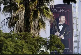  ?? Photos and text from The Associated Press ?? An advertisem­ent for Sunday’s 95th Academy Awards features host Jimmy Kimmel.