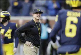  ?? ASSOCIATED PRESS FILE ?? Michigan coach Jim Harbaugh is 28-11 since taking over the Wolverines. The Wolverines have struggled against their biggest rivals, going 1-5 against Ohio State and Michigan State. Michigan opens this season at Notre Dame.