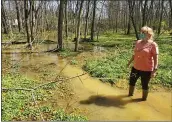  ?? BILL RETTEW — MEDIANEWS GROUP ?? West Whiteland resident Libby Madarasz checks out the damage at the Mariner East pipeline constructi­on site near the Chester County Library.