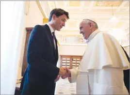  ?? AP PHOTO ?? Prime Minister Justin Trudeau shakes hands with Pope Francis on the occasion of their private audience at the Vatican.