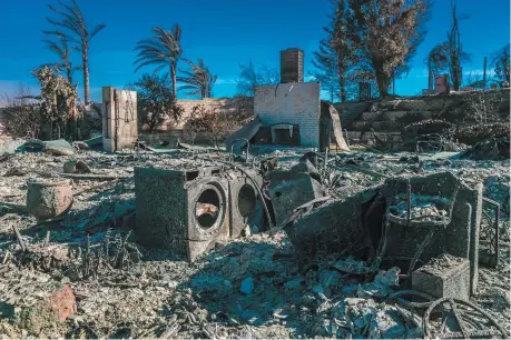  ??  ?? A house destroyed by the Thomas Fire in Ventura, California, the largest fire in California history, December 2017