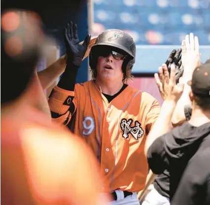  ?? BILLY SCHUERMAN/THE VIRGINIAN-PILOT ?? Norfolk first baseman Heston Kjerstad, shown last season, went 3-for-5 with two homers and four RBIs in the Tides’ victory over Charlotte on Tuesday night.