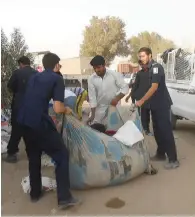  ?? Supplied photo ?? Sharjah Municipali­ty staff confiscate counterfei­t items sold in the make-shift markets. —