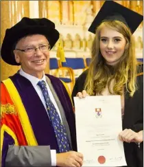  ??  ?? Tamara Lewis from New Ross receiving her BA in Criminal Justice Studies from WIT president Prof Willie Donnelly.