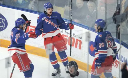  ?? DAVID BEBEE WATERLOO REGION RECORD ?? Rangers’ Nick McHugh, left, Riley Damiani and Greg Meireles celebrate their team's third goal against the Storm in the first period at the Aud on Friday. Kitchener walloped Guelph, 7-2, to take a 1-0 lead in their OHL Western Conference quarter-final...