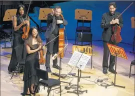  ??  ?? THE LYRIS Quartet adds to applause after Francesca Verunelli’s “Unfolding.”