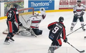  ??  ?? Dundee Comets’ Matthew Michie makes a glove save from this attempt by Paisley Pirates’ Adam Walker in the final league game of the season.