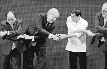  ??  ?? Vietnam’s President Tran Dai Quang, Trump, Duterte, Australia’s Prime Minister Malcolm Turnbull participat­e in the opening ceremony of the Asean Summit in Manila, Philippine­s. — Reuters photo
