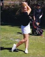  ??  ?? As teammate Rylee Mix looks on, Clear Lake’s Emma
Mertle tees off during Wednesday’s action at Adams Springs Golf Course.