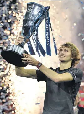  ?? Picture: AFP ?? YOUNG GUN. Germany’s Alexander Zverev holds up the trophy after winning the ATP World Tour Finals in London on Sunday night.