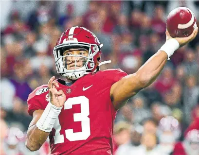  ?? VASHA HUNT THE ASSOCIATED PRESS FILE PHOTO ?? Quarterbac­k Tua Tagovailoa is a natural right-hander, but his father taught him to throw with his left hand when he was a boy.