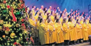  ?? JOE BURBANK/ORLANDO SENTINEL ?? Cast members perform in the choir for Candleligh­t Procession­al, a holiday offering at Epcot. The nightly performanc­es continue through Dec. 30.