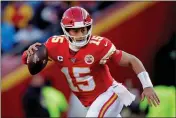  ?? CHARLIE RIEDEL — THE ASSOCIATED PRESS ?? The Kansas City Chiefs’ Patrick Mahomes scrambles during the first half of the AFC Championsh­ip game against the Tennessee Titans on Sunday.