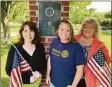  ?? Brian Gioiele / Hearst Connecticu­t Media ?? Derby-Shelton Rotary Club members Rosemary Allen, left, Julie Blakeman, center, and Linda Holmes-Hannon prepare for opening of the club’s Flags for Heroes project to be displayed at Veteran’s Memorial Park beginning on Saturday.