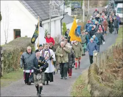  ?? Photograph: Abrightsid­e photograph­y. ?? Clan representa­tives and members of the community proceed towards the memorial following a service in St Mary’s Church in Glencoe.