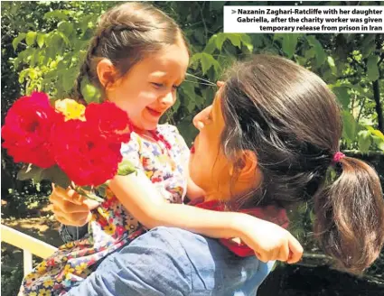  ??  ?? &gt; Nazanin Zaghari-Ratcliffe with her daughter Gabriella, after the charity worker was given temporary release from prison in Iran