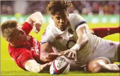  ??  ?? Wales’ Gareth Anscombe had a try disallowed with the TMO ruling Anthony Watson of England had touched it down first