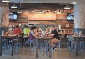  ?? APPEAL JIM WEBER/THE COMMERCIAL ?? The small farm-to-table burger chain Farm Burger has grown an outlet in Crosstown Concourse touting a simple menu of grass-fed beef burgers, fries, salads, and shakes.