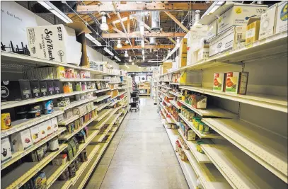  ?? Richard Brian ?? Sparsely stocked shelves Dec. 19 at The Market in downtown Las Vegas, an area that lacks a supermarke­t. Las Vegas Review-journal