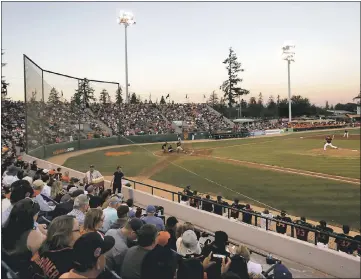  ?? NHAT V. MEYER — STAFF PHOTOGRAPH­S ?? Madison Bumgarner pitches for the San Jose Giants in their game against the Modesto Nuts at Municipal Stadium.