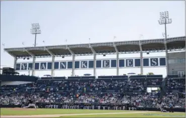  ?? PHOTOS BY MATT ROURKE — THE ASSOCIATED PRESS ?? New York Yankees starting pitcher Masahiro Tanaka pitches to Detroit Tigers’ Nick Castellano­s during the first inning of a spring training baseball game against the Detroit Tigers Tuesday in Tampa, Fla.