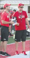  ?? PHOTO/RUSTY NIXON ?? LEFT: First year Plymouth head coach Adam Handley (right) discusses strategy with second year assistant Josh Dingeldein Thursday at the Rockies scrimmage.