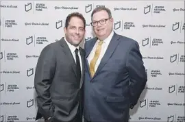  ?? Michael Kovac Getty Images ?? BRETT RATNER and Marty Singer at a Hollywood dinner. Singer sent letters to The Times as the paper prepared to report on the accusation­s against Ratner.