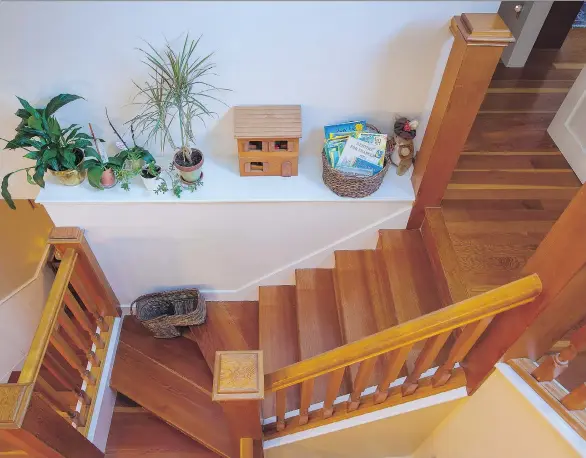  ?? PHOTOS BY DEBRA BRASH ?? This staircase splits at the landing, heading to bedrooms and an office. Staircases present a golden opportunit­y for a homeowner, builder or designer.