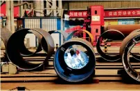  ?? AFP ?? China’s year-long constructi­on boom may be slowing, but stillrobus­t industrial earnings will be good news its leaders. —