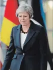  ?? SEAN GALLUP GETTY IMAGES ?? British Prime Minister Theresa May arrives for a working dinner of EU leaders on Wednesday.