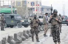  ?? AFP ?? Afghan security personnel stand guard near the site of an attack to a Sikh temple in Kabul.