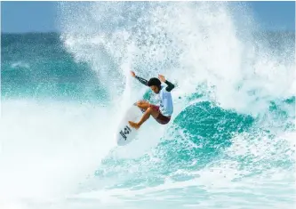  ?? | WSL/SLOANE ?? Michael February ramps off the white water in a move called the floater in the Billabong Pipeline Masters.