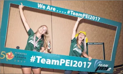  ?? JASON MALLOY/THE GUARDIAN ?? Kylee Wallace, left, and Madison Dayton ham it up for a photo before Team P.E.I.’s athletes rally Tuesday in Charlottet­own. The Island contingent is preparing to compete at the Canada Games this summer in Winnipeg.