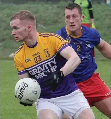  ??  ?? Pierce Dooley of St. Mary’s is watched closely by Aidan Jones.