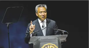  ?? ASSOCIATED PRESS FILE PHOTO ?? Kevin Tsujihara, chairman and CEO of Warner Bros., during a presentati­on at CinemaCon 2015 in Las Vegas, Nev. Tsujihara is stepping down after claims that he promised acting roles in exchange for sex.