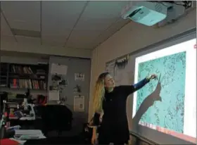  ?? REBECCA BLANCHARD — DIGITAL FIRST MEDIA ?? Danielle Weyershaeu­ser uses the digital microscope with her seventh-grade classes as they learn about cells. The digital microscope was purchased for Middle School West through the a grant funded by the Foundation for Boyertown Education.