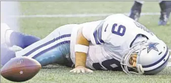  ??  ?? Tony Romo is in pain after a hit from behind, but he’s able to walk off and appears to be OK.