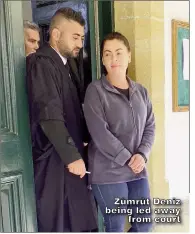  ?? ?? Zümrüt Deniz being led away from court