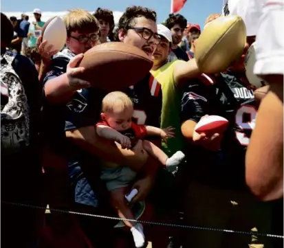  ?? 2022 FILE/JESSICA RINALDI/GLOBE STAFF ?? Oh baby, the fans will get up close and personal with the Patriots at training camp this week.