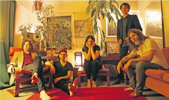  ??  ?? Black Mountain, from left, Jeremy Schmidt, Colin Cowan, Amber Webber, Josh Wells, and Stephen McBean. In a strange twist of fate, the promo shot, which inadverten­tly featured David Bowie’s Hunky Dory album cover between Webber and Wells, was taken the night before Bowie died. The group plays the Commodore on May 21.