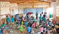  ??  ?? Arran students help a classroom full of children at Mtemba School