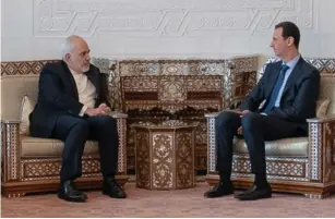  ?? DR ?? Presidente sírio, Bashar al-Assad (à direita), com o ministro enviado do Irão