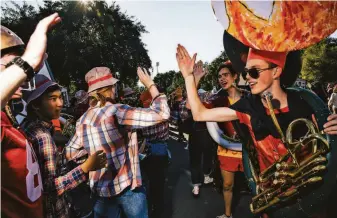  ?? Photos by Stephen Lam / The Chronicle ?? Above: The Leland Stanford Junior University Marching Band plays before the Big Game at Stanford.