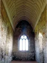  ??  ?? On the east wall of the chapel, a large three-arched window filters winter light onto the stone floor.