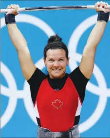  ?? FILE PHOTO ?? Canadian weightlift­er Christine Girard will soon be the proud owner of an Olympic gold medal from the 2012 London Games.