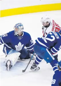  ?? PETER J. THOMPSON ?? Washington Capitals forward Marcus Johansson scored on Toronto Maple Leaf goalie Frederick Andersen in overtime in Game 6 to win the game and eliminate the Leafs from playoff contention Sunday.